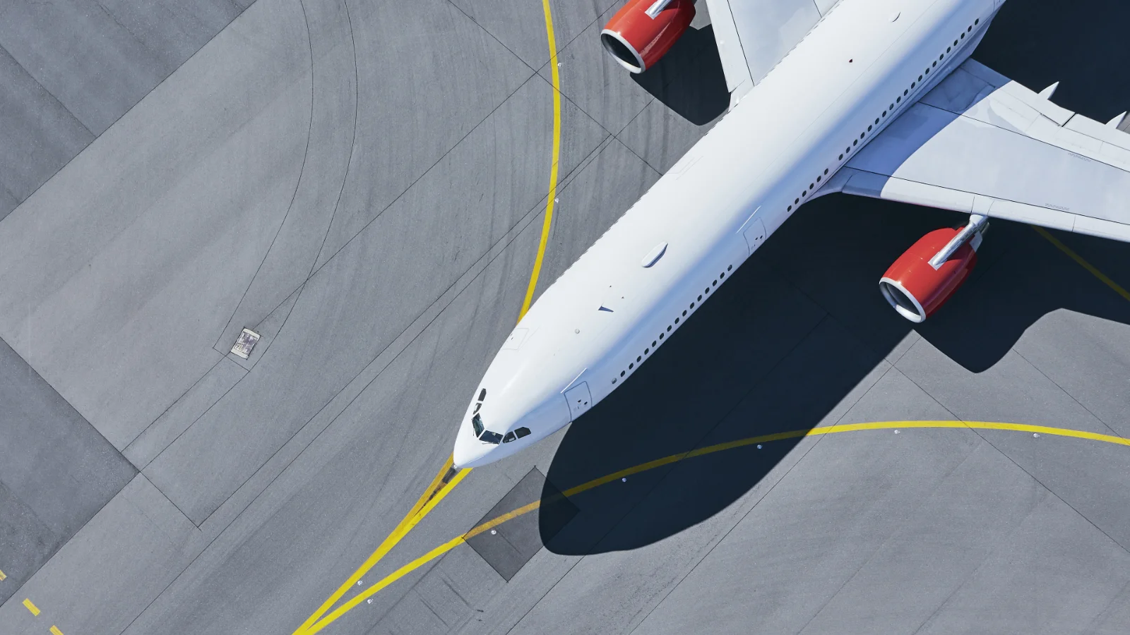 Vector helps aerospace teams manage distributed systems with the visibility and control needed across development. Concept image of a white passenger aircraft on a runway.